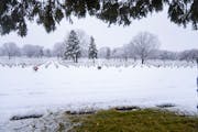 Snow fell on headstones Thursday at Fort Snelling National Cemetery.