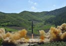 This photo distributed by the North Korean government shows what was said to be the launch of a Hwasong-14 intercontinental ballistic missile, ICBM, i