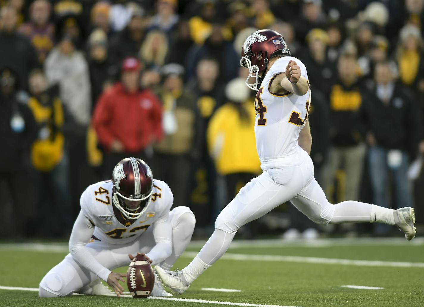 Minnesota Gophers holder Jacob Herbers (47) set up a kick for place kicker Brock Walker (34), who scored a field goal in the final seconds of the second quarter. ] Aaron Lavinsky &#x2022; aaron.lavinsky@startribune.com The Minnesota Gophers played the Iowa Hawkeyes on Saturday, Nov. 16, 2019 at Kinnick Stadium in Iowa City, IA.