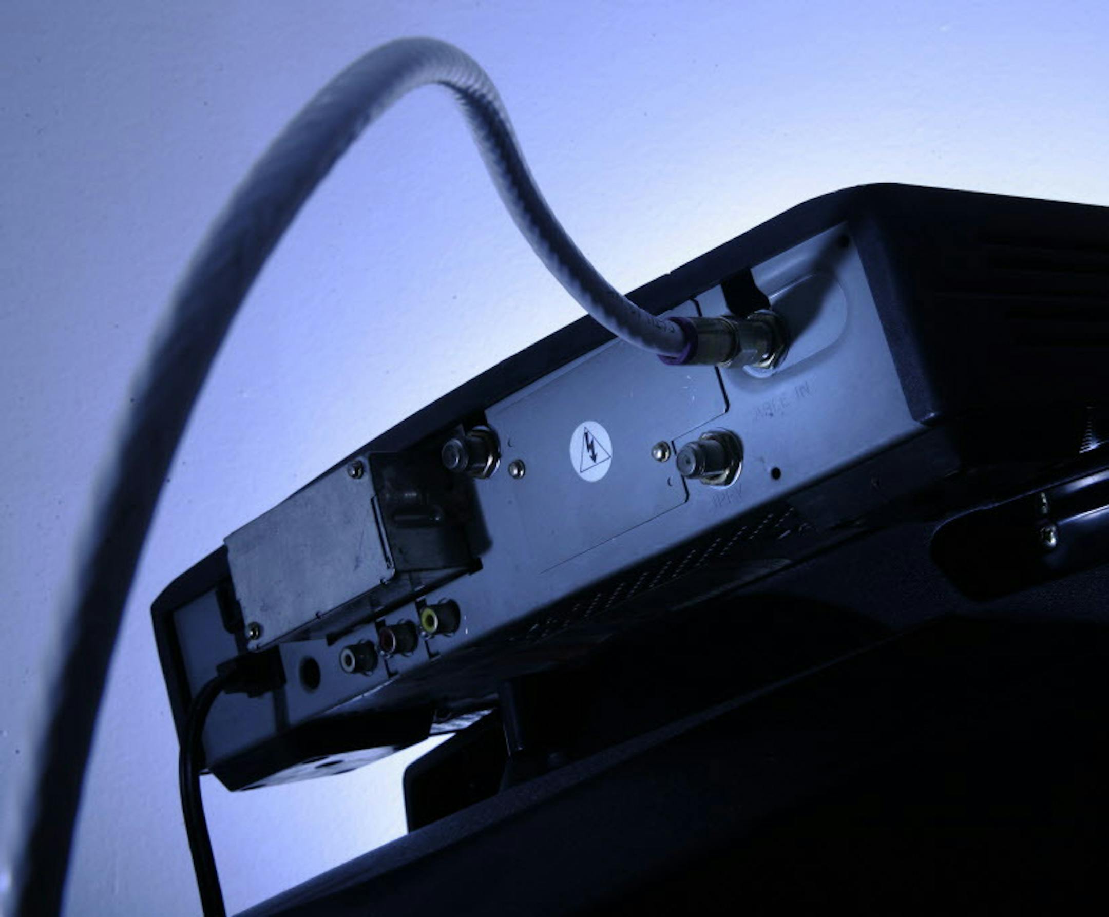 FILE - This May 30, 2007 file photo shows a cable box on top of a television in Philadelphia. Cord cutters rejoiced last week after HBO and CBS announced plans to sell stand-alone streaming services, a move that cable and satellite television providers have resisted for years. But cutting the cord wonít mean cutting out your cable provider, and some would-be customers may balk when they see just how much paying a la carte actually costs. (AP Photo/Matt Rourke, File)