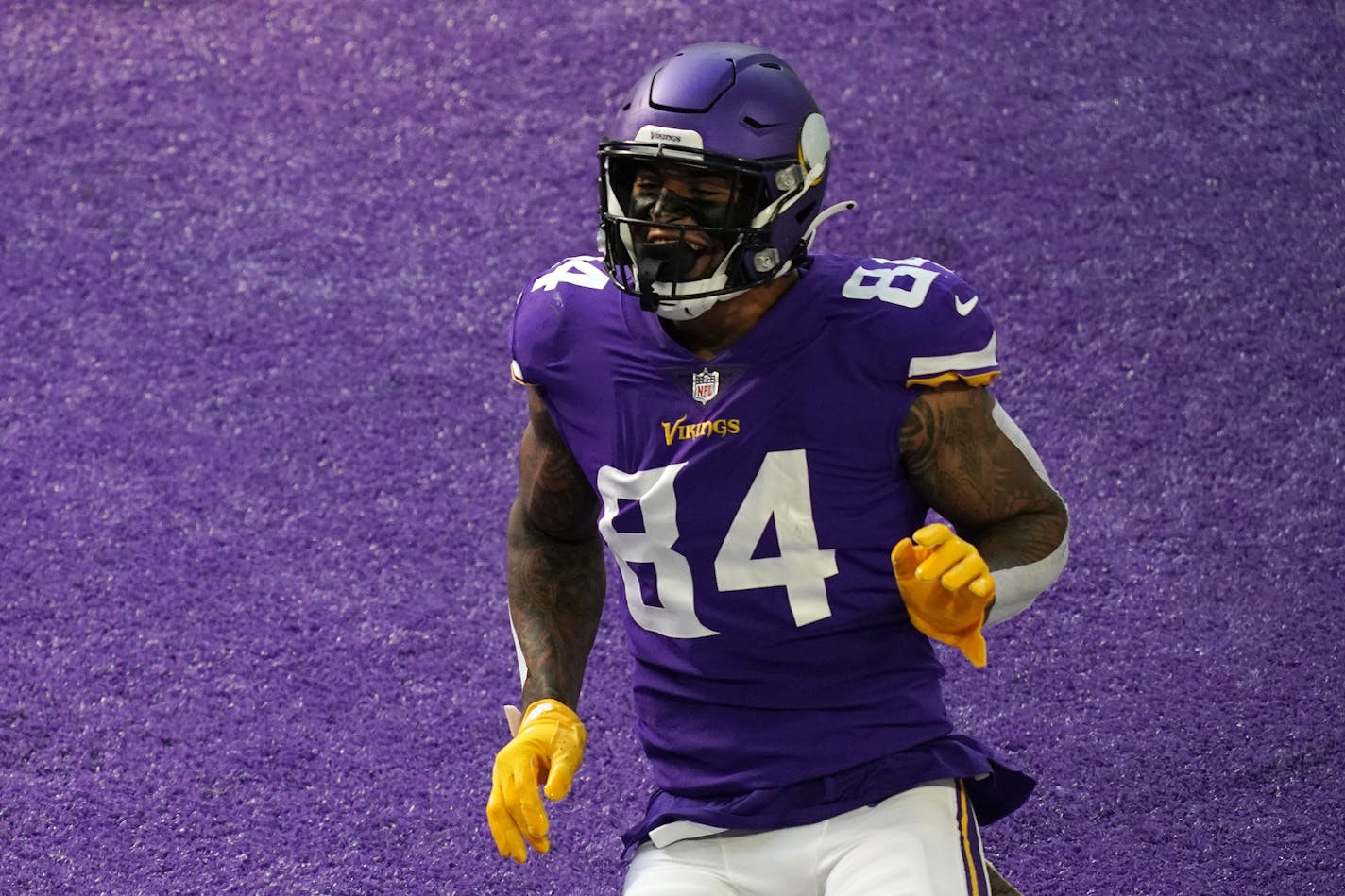 Irv Smith celebrated after scoring for the Vikings against Detroit on Nov. 8 at U.S. Bank Stadium.