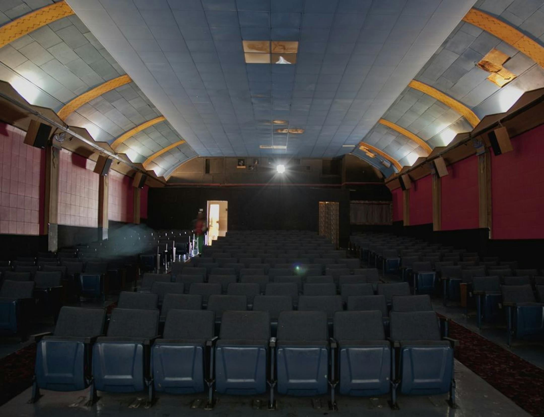 In this photo from Sept. 4, 2012, a lone spectator enters the Isis movie theatre for the 6:30 showing of a movie, in Crete, Neb. The Isis Theatre hasn�t changed much since it opened 86 years ago, but as the movie industry phases out the traditional 35 mm film reels in favor of digital media, the Isis� owner must come up with $85,000 to buy new projection equipment, computers, a sound system and even a different screen. It is a huge financial burden for the small theatre.