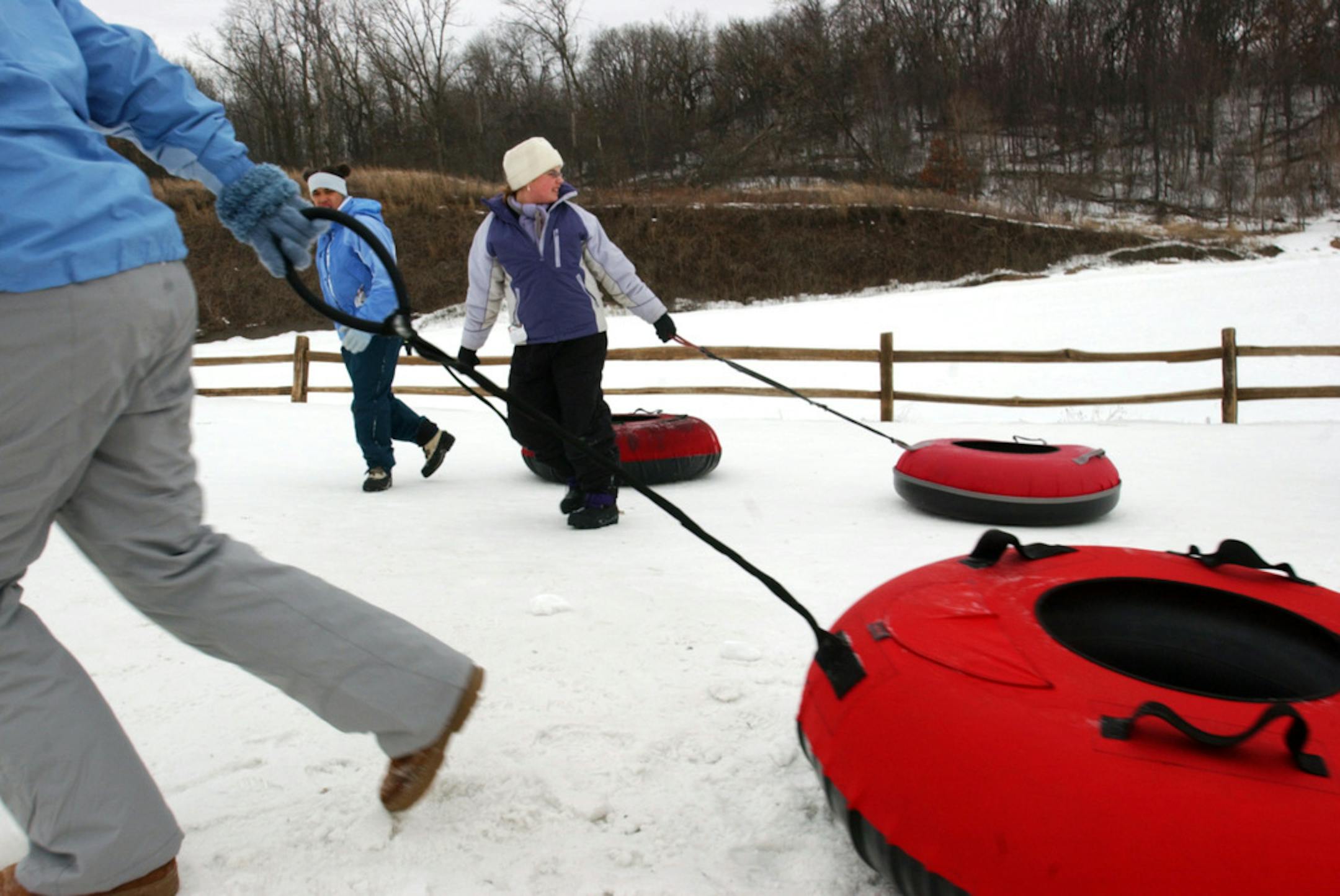 Beth Schlanker/Star Tribune Friday Jan. 28, 2005 Kids haul their inner tubes back up the to the tow ropes Friday afternoon at Buck Hill Ski Area in Burnsville, MN. The wooded area located north of the tubing hill is planned to be rezoned for development, and the ski area will also be rezoned to preserve its use for recreation.
GENERAL INFORMATION: Beth Schlanker/Star Tribune Friday Jan. 28, 2005 Buck Hill Ski area rezoning- tubing hill