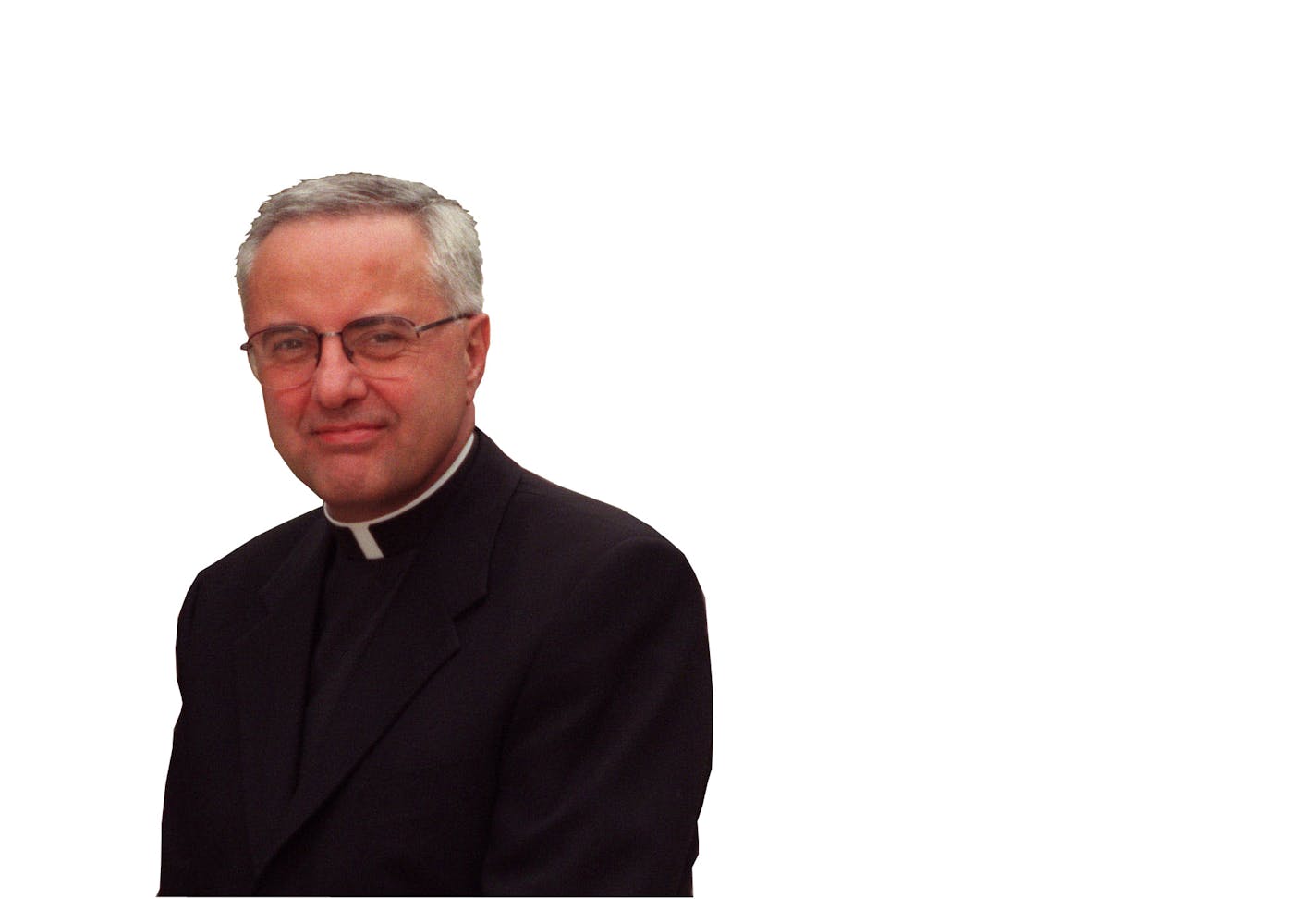 Rev. Dennis Dease, president of the University of St. Thomas, has lead the school to great growth. -- St. Paul, Mn., Thurs., June 2, 2000--The Rev. Dennis Dease, president of the University of St. Thomas, sits near the arches leading into the school�s campus.