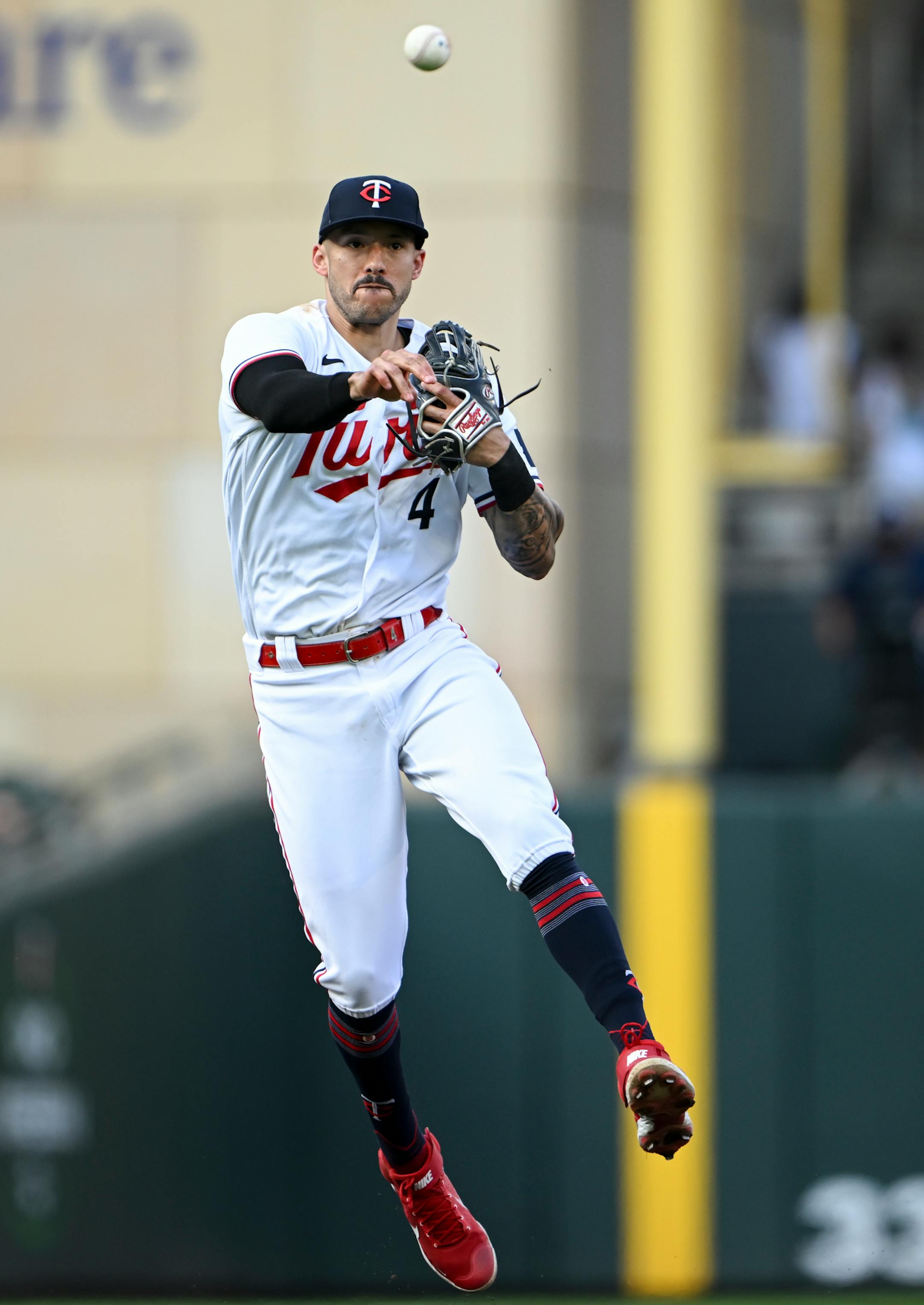 Minnesota Twins shortstop Carlos Correa (4) throws to first for an out after fielding a ground ball hit by Boston Red Sox shortstop Enrique Hernandez (5) in the top of the second inning Wednesday, June 21, 2023, at Target Field in Minneapolis, Minn.