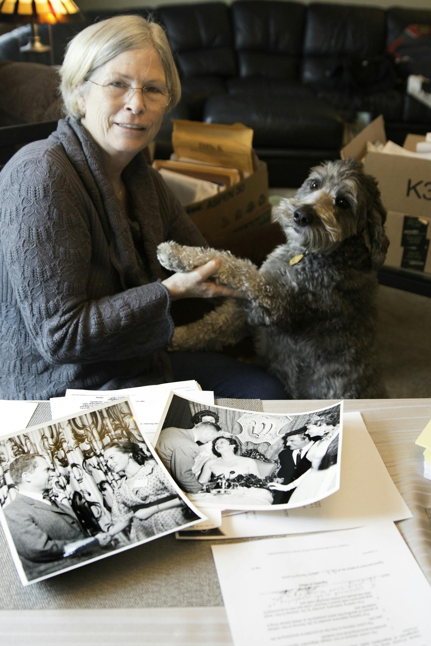 Catherine O'Connor shares some keepsake photos of her mother, Patricia Heinrich, amid the boxes of court documents and other records that marked a bitter conservatorship battle at the end of her life.