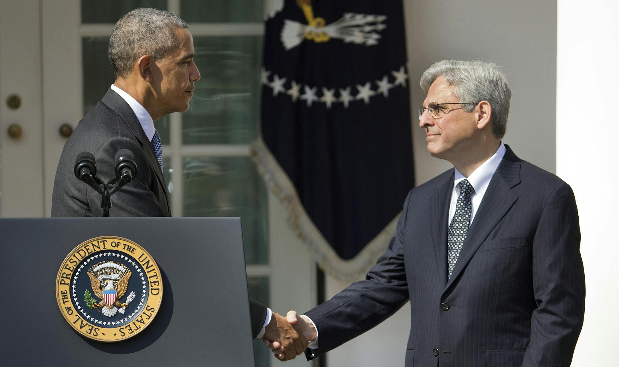 Federal appeals court judge Merrick Garland shakes hands with President Barack Obama as he is introduced as Obama's nominee for the Supreme Court during an announcement in the Rose Garden of the White House, in Washington, Wednesday, March 16, 2016.(AP Photo/Pablo Martinez Monsivais) ORG XMIT: MIN2016031613021039