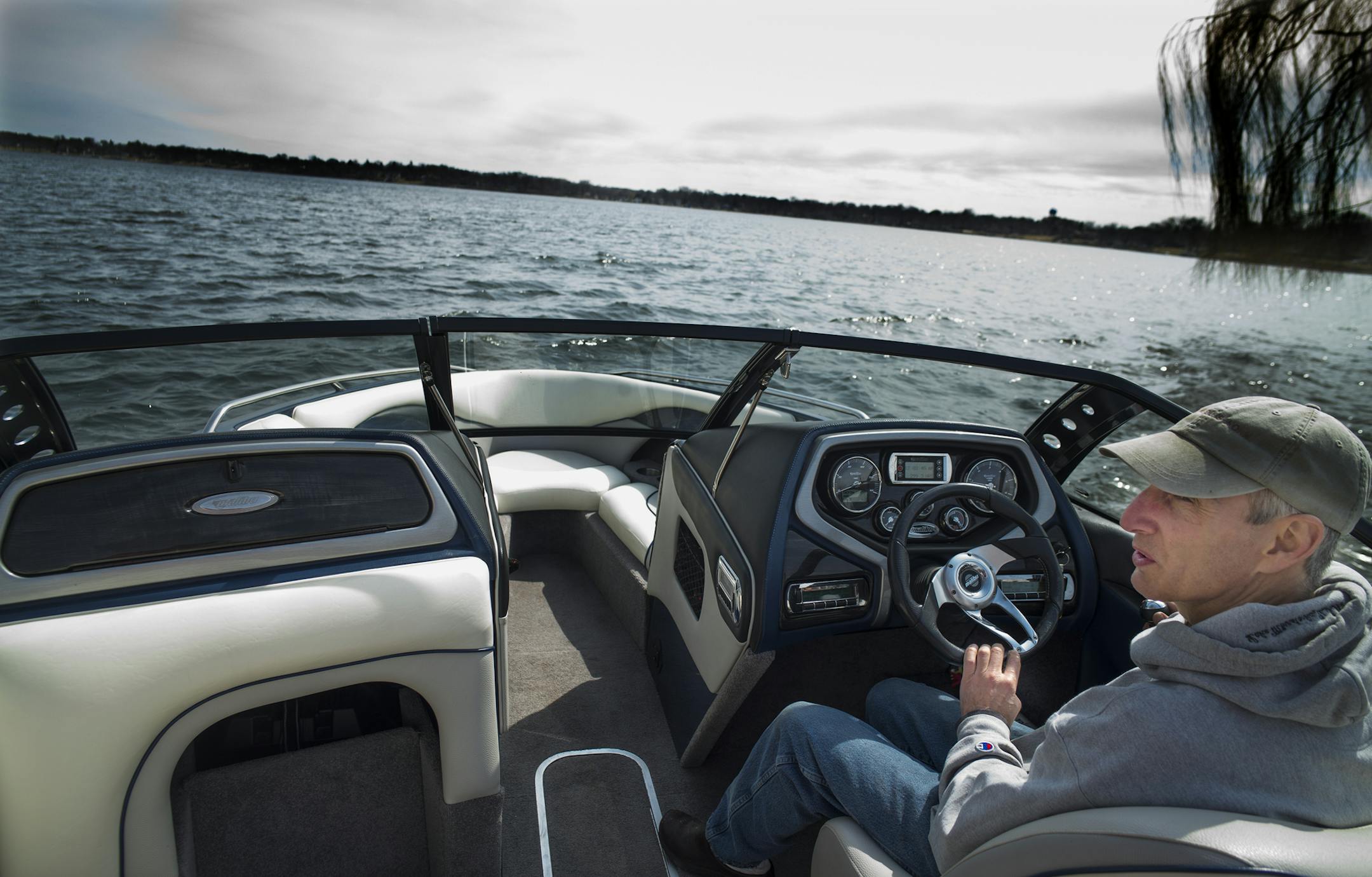 On Lake Minnetonka, Mike Bloom of Orono put out his Malibu wake boat so he could take it to his dock. Bloom is alway one of the first ones on the water because he puts in his own dock.] Richard Tsong-Taatarii/rtsong-taatarii@startribune.com