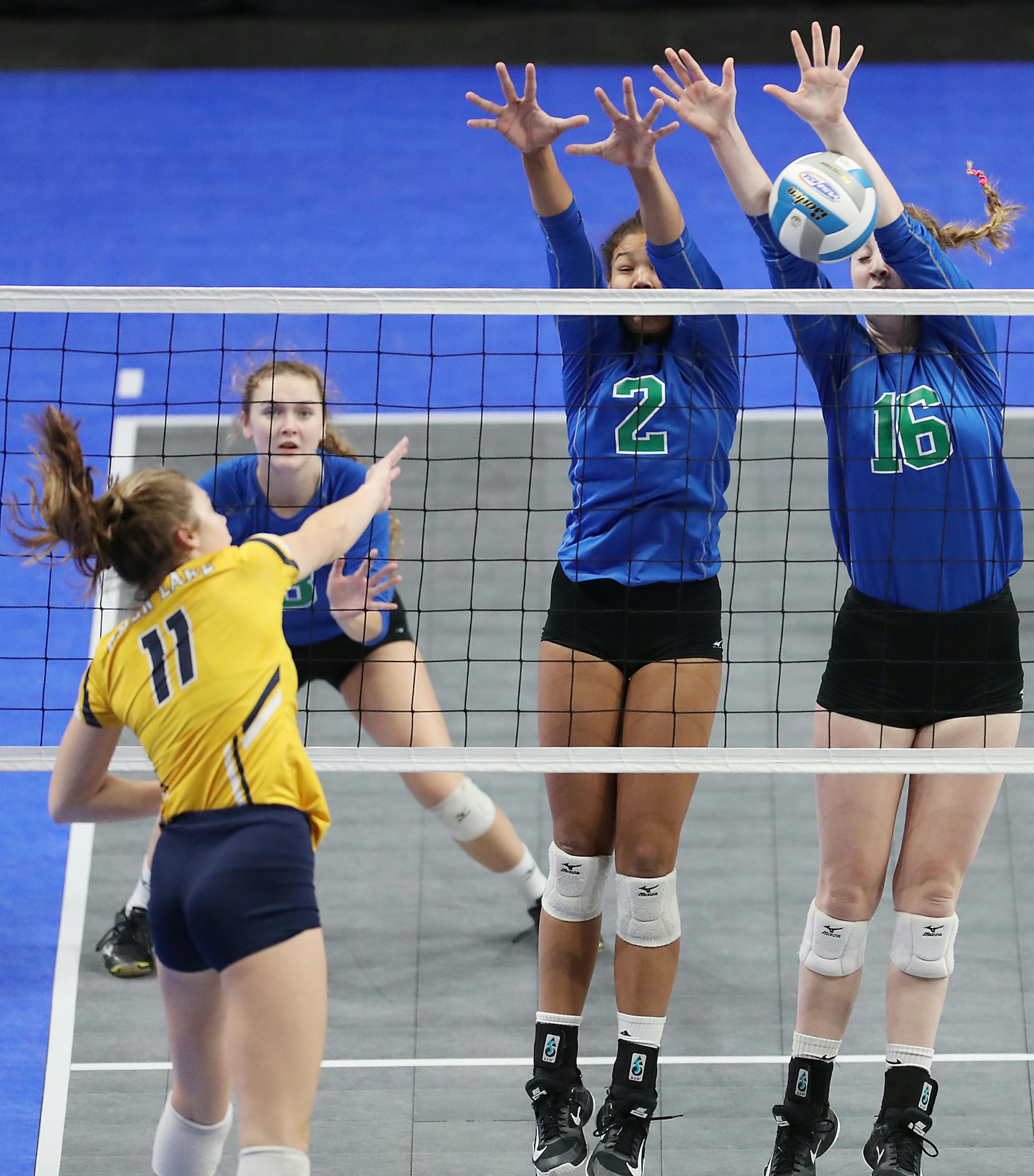Kennedi Orr (2) and Ellie Husemann (16) of Eagan High School block a hit by Emma Brostrom (11) of Prior Lake High School. ] LEILA NAVIDI ï leila.navidi@startribune.com BACKGROUND INFORMATION: Eagan High School plays against Prior Lake High School in the Class 3A volleyball semifinals at Xcel Energy Center in St. Paul on Friday, November 20, 2017. Eagan won the match 3-0.