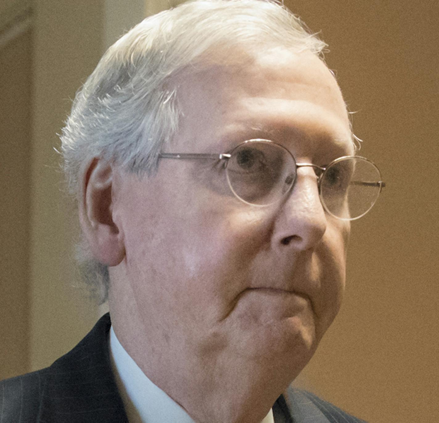 Senate Majority Leader Mitch McConnell, R-Ky, heads to a meeting with Treasury Secretary Steven Mnuchin, Trump's top economic adviser Gary Cohn, and members of the Senate Budget Committee as they struggle with a tax code overhaul that will add to the deficit as they work on a GOP budget plan that's a prerequisite to any far-reaching change in the nation's tax system, at the Capitol in Washington, Tuesday, Sept. 12, 2017. (AP Photo/J. Scott Applewhite)