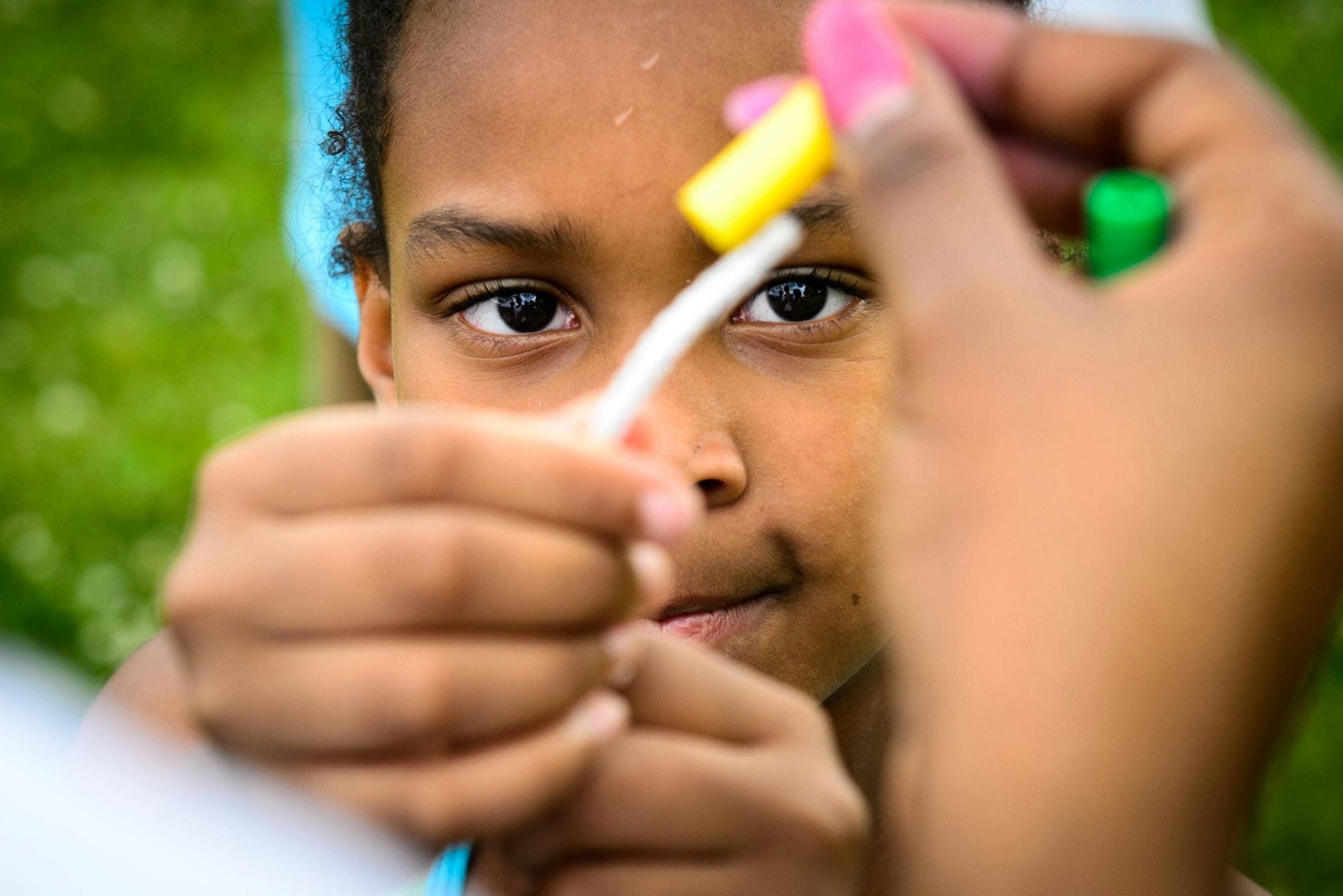 With a little help, Shania Elliott, 6, strung together her own jump rope at the pop-up park Tuesday in north Minneapolis.