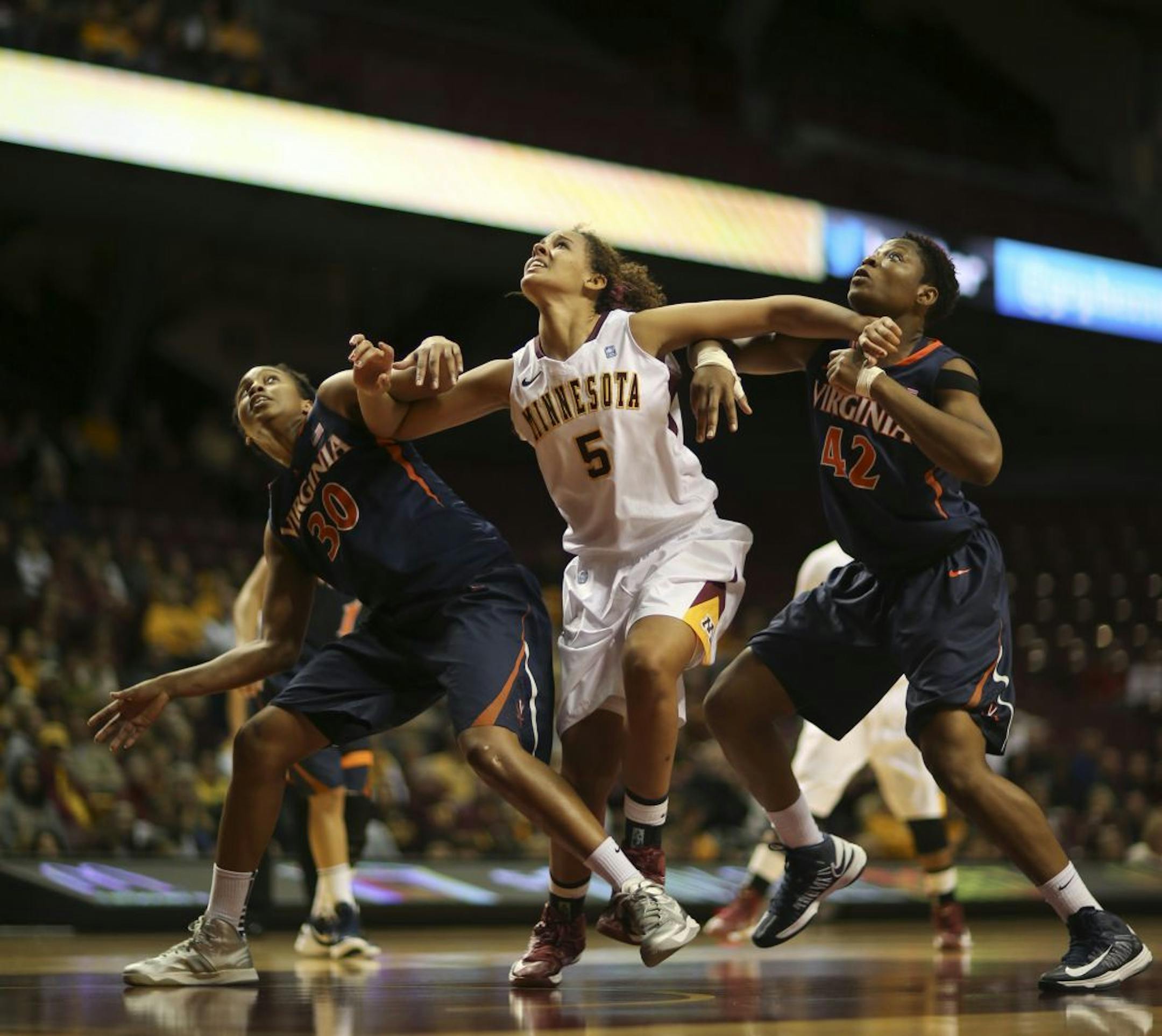 Minnesota's Kionna Kellogg vied for a first half rebound under the Gophers' net.