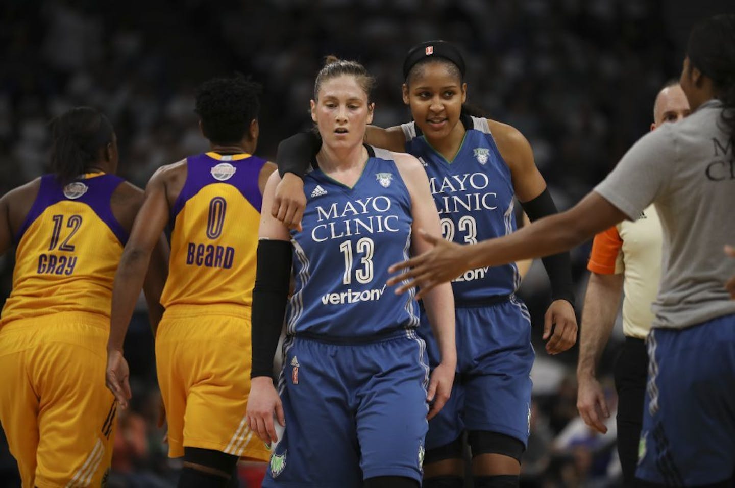 Minnesota Lynx forward Maya Moore (23) wrapped an arm around Minnesota Lynx guard Lindsay Whalen (13) as they walked to the bench for a time out in the second quarter.