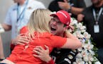 Will Power celebrated with his wife, Liz, after winning the Indianapolis 500 on Sunday.