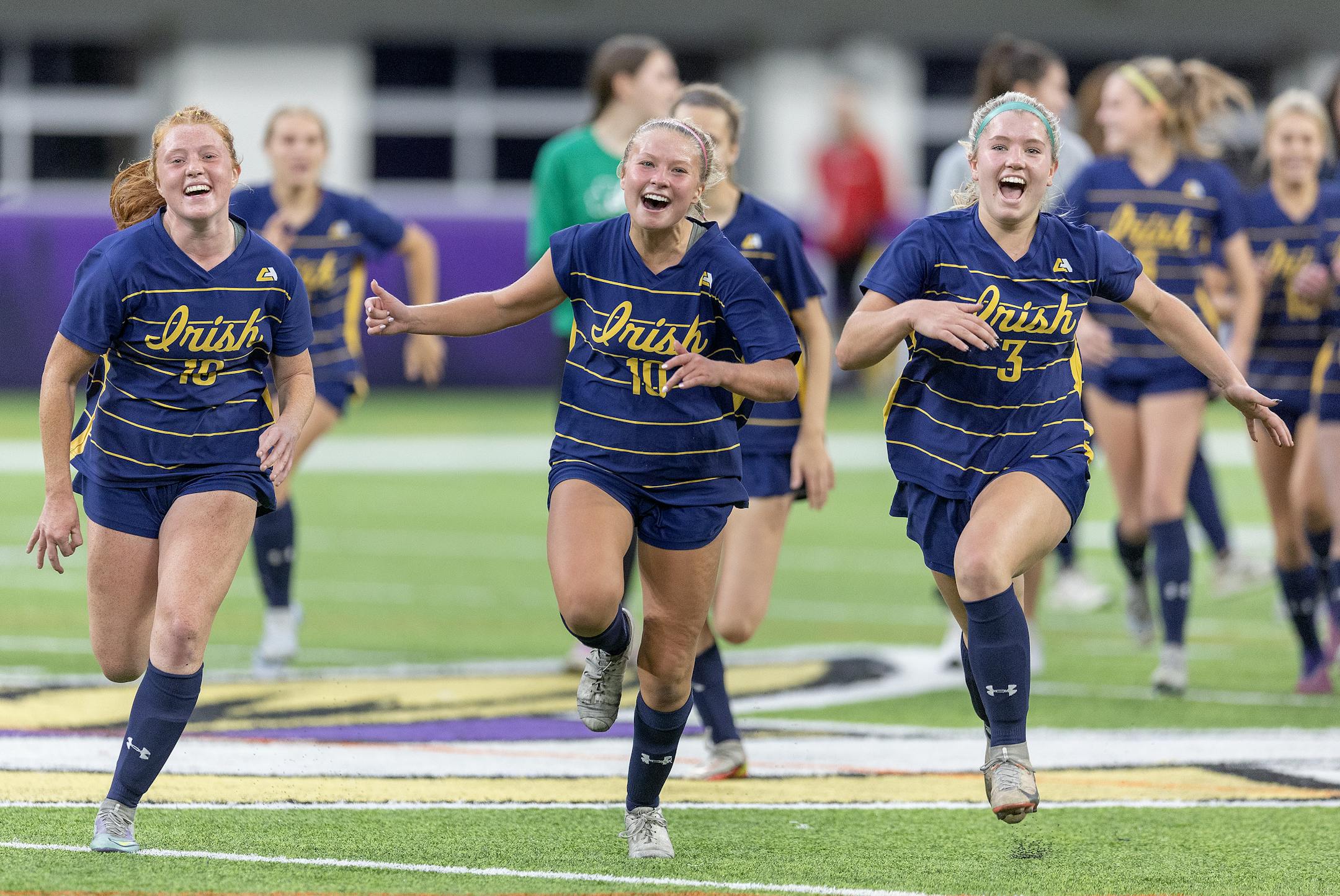 Rosemount's Sydney Gilbertson, left, Rilyn Rintoul, center, and Ava Thompson ran onto the field to celebrate their 1-0 win over Edina at US Bank Stadium