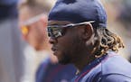 Minnesota Twins' Miguel Sano is seen in the dugout tduring the ninth inning of a baseball game against the Detroit Tigers, Thursday, June 14, 2018, in