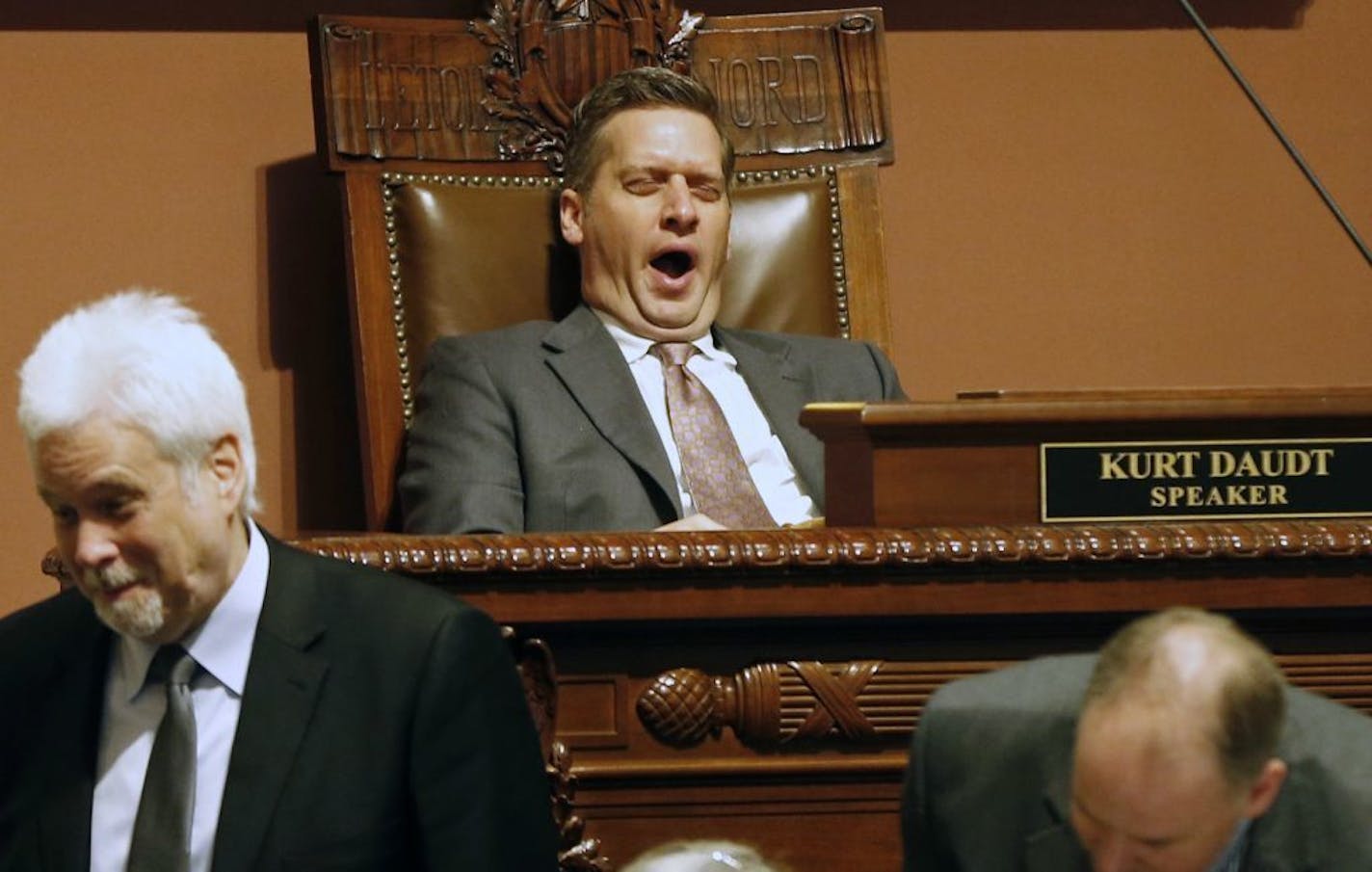 House Speaker Kurt Daudt yawns as he, chief clerk Patrick Duffy Murphy, left, and others wait for roll call to be completed during Day 3 of the special session Thursday, May 25, 2017 in St. Paul, Minn. where lawmakers continue to make another run of passing the major remaining parts of a $46 billion budget.