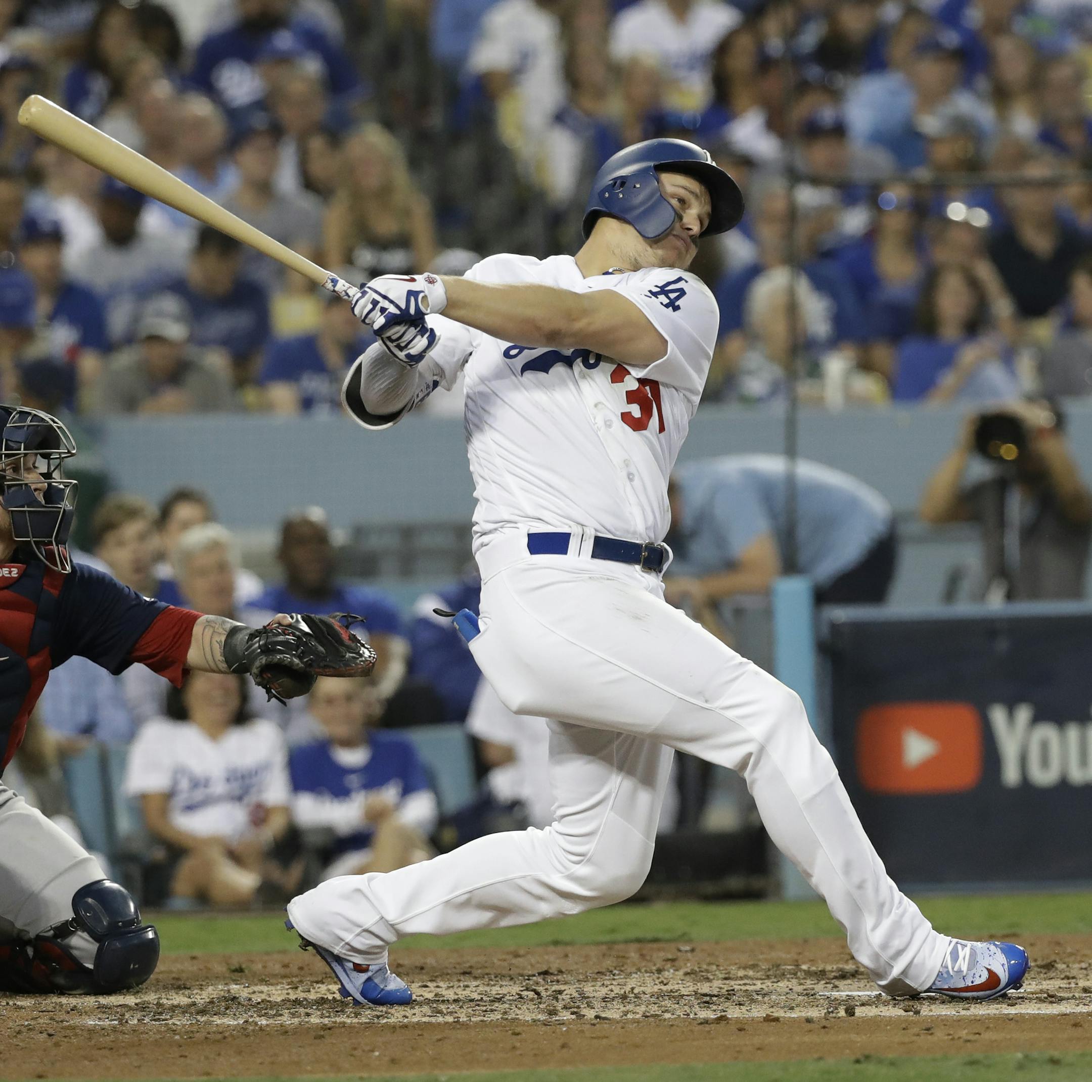 Boston Red Sox's catcher Christian Vazquez watches as Los Angeles Dodgers' Joc Pederson follows through on his home run during the third inning in Game 3 of the World Series baseball game on Friday, Oct. 26, 2018, in Los Angeles. (AP Photo/David J. Phillip)