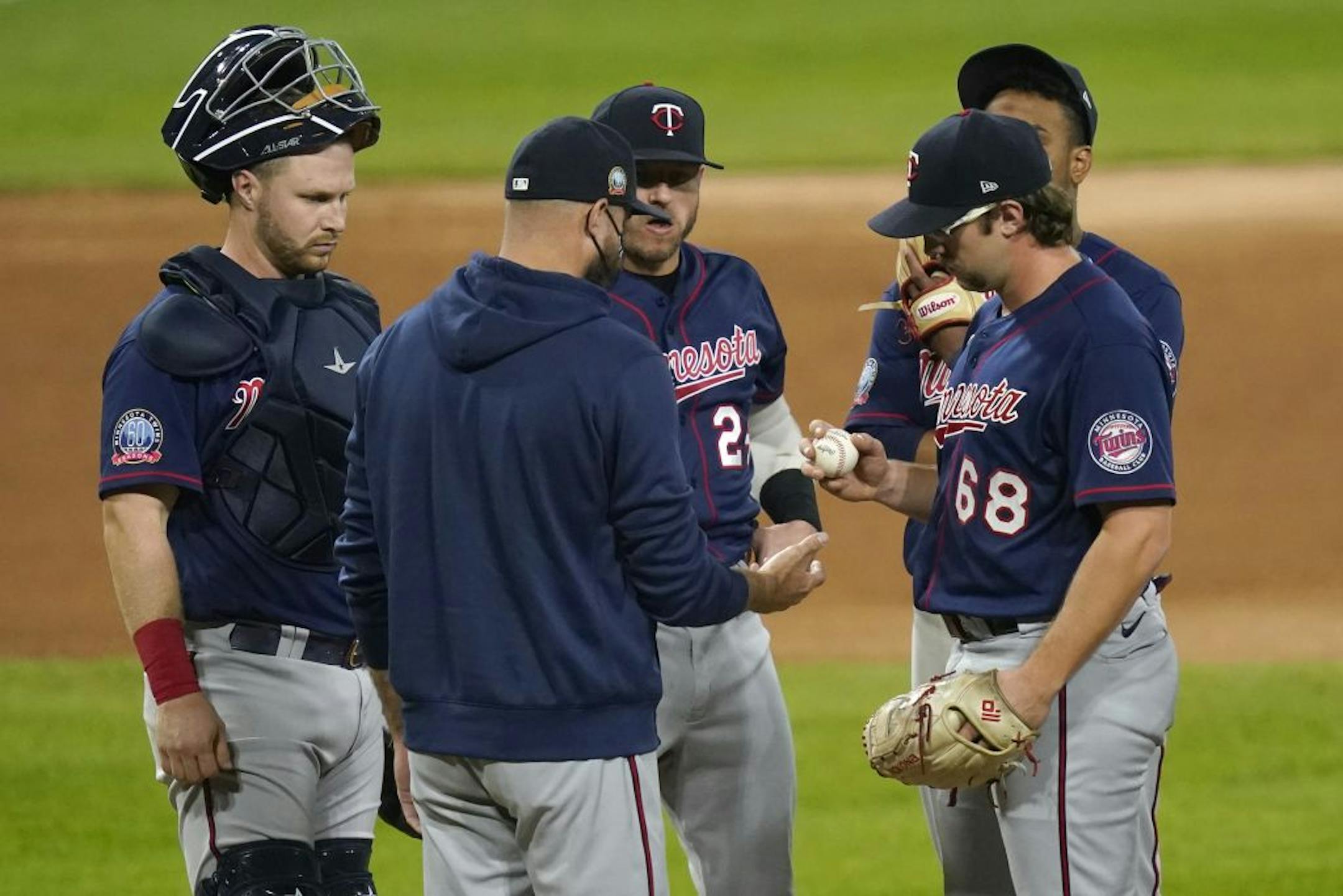 Minnesota Twins manager Rocco Baldelli, center, pulls Minnesota Twins starting pitcher Randy Dobnak (68) during the fifth inning of the team's baseball game against the Chicago White Sox on Tuesday, Sept. 15, 2020, in Chicago.