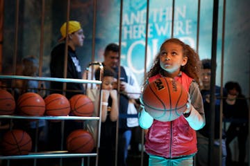 Whitney People, 9, focused on the hoop as she prepared for her shot at the Game of Thrones/AT&T court. Final Four Fan Fest at the Minneapolis Conventi