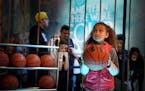 Whitney People, 9, focused on the hoop as she prepared for her shot at the Game of Thrones/AT&T court. Final Four Fan Fest at the Minneapolis Conventi