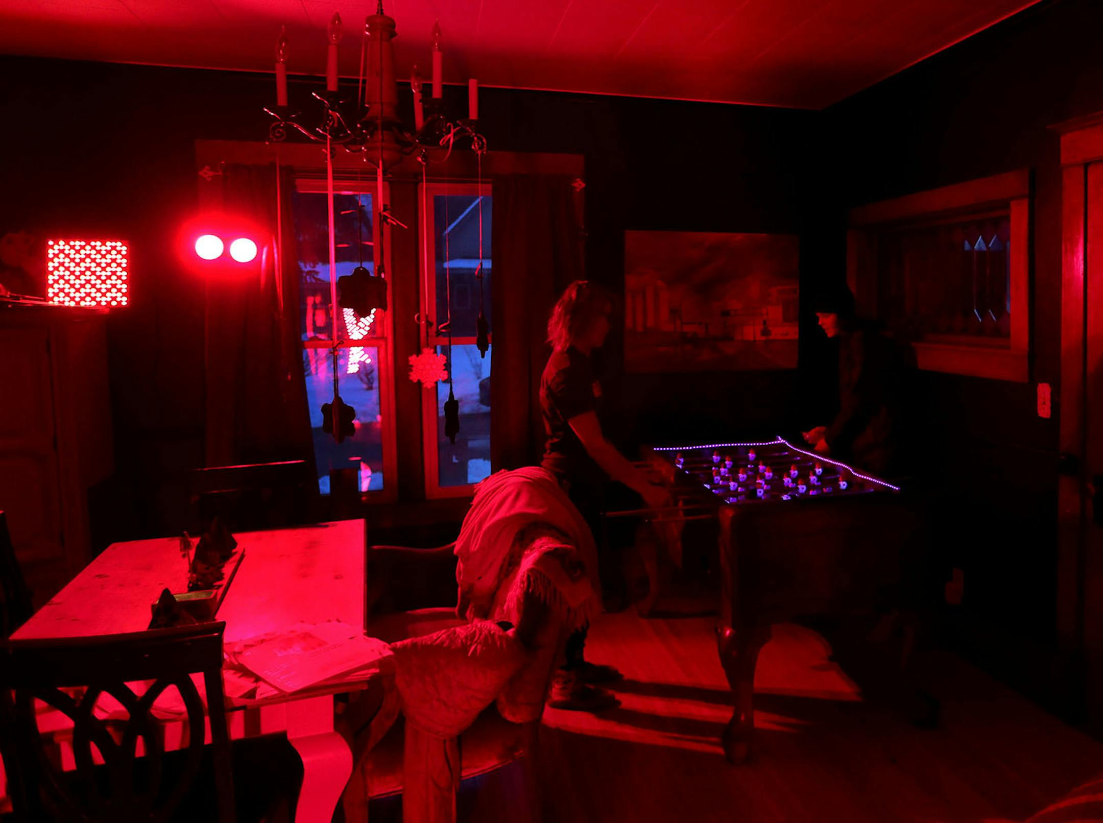 Biohacker Heidi Sime plays foosball with her son Jaxson, 17, before sunrise.