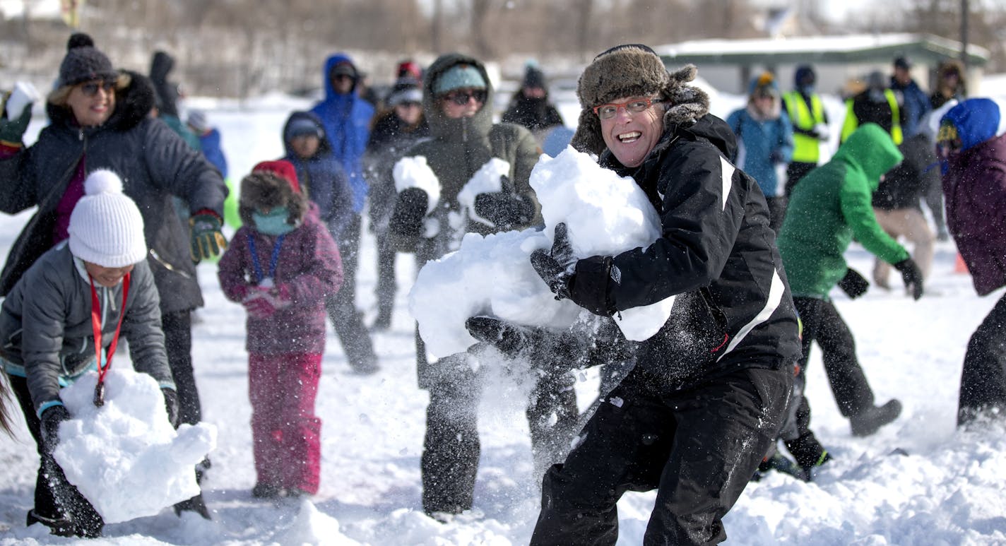 A snowball fight was held at McMurray Fields between the cities of St. Paul and Minneapolis. Paul Chellsen who lives in St.Paul but works for the city of Minneapolis tossed a huge snowball at team St. Paul during a snowball fight Sunday February 24, 2019 in St. Paul, MN.] Jerry Holt &#x2022; Jerry.holt@startribune.com