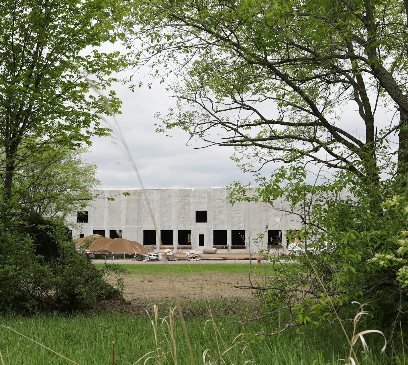 Construction of a corrugated cardboard factory is well under way at the Southeast Industrial Park in Cottage Grove, Minn. Other lots in the area adjacent to the constructions are available for development. ] Shari L. Gross &#xef; shari.gross@startribune.com Long thought of as the red-headed step child of commercial real estate, industrial construction has been booming in the Twin Cities as office and retail has been more stagnant. Hard hat tour of the construction of the Southeast Industrial Par