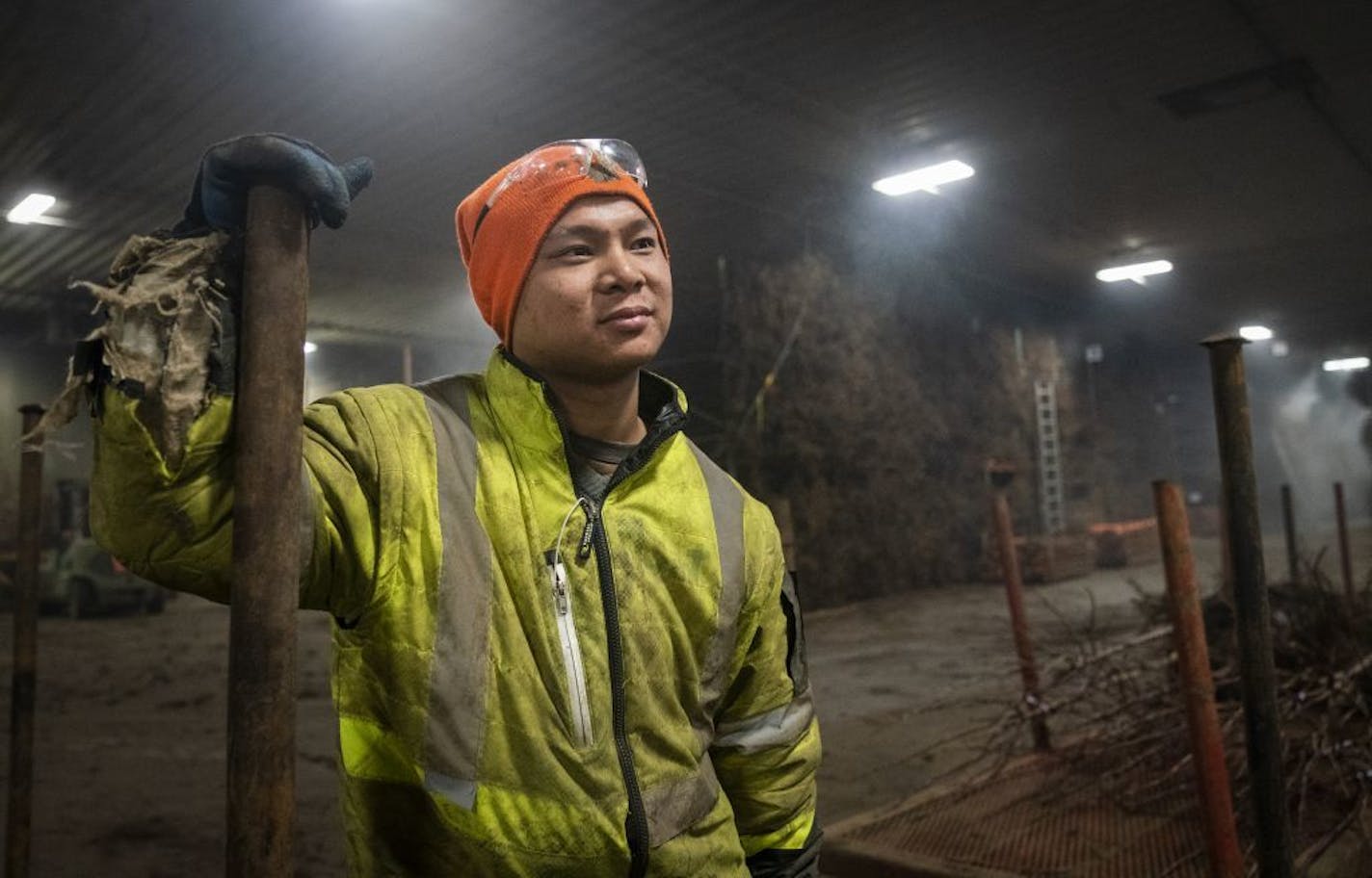 Assistant foreman Myint Soe, a Karen refugee, takes a quick break during his work day at the Bailey Nurseries warehouse in Newport on Jan. 16. President Donald Trump will soon set an annual ceiling on refugees for the fiscal year that begins in October.