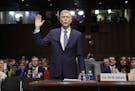 Supreme Court Justice nominee Neil Gorsuch is sworn-in on Capitol Hill in Washington, Monday, March 20, 2017, during his confirmation hearing before t