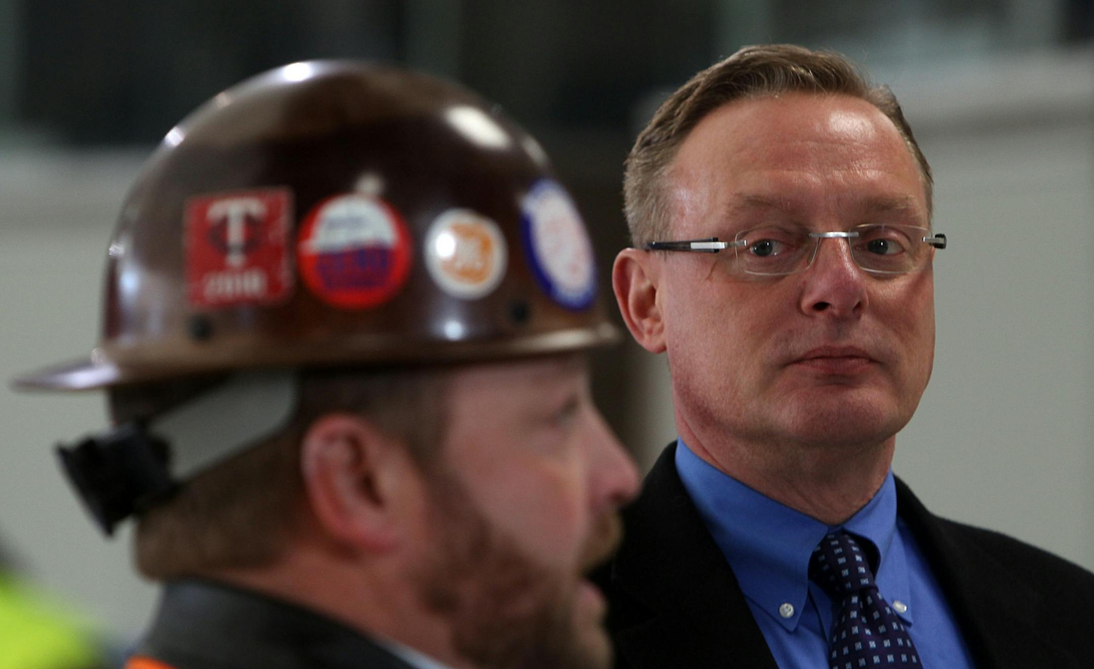 Ted Mondale (right), chairman of the Metropolitan Sports Facilities Commission, listened as iron worker Charlie Roberts (Local 512) spoke at a news conference about the roof's replacement.