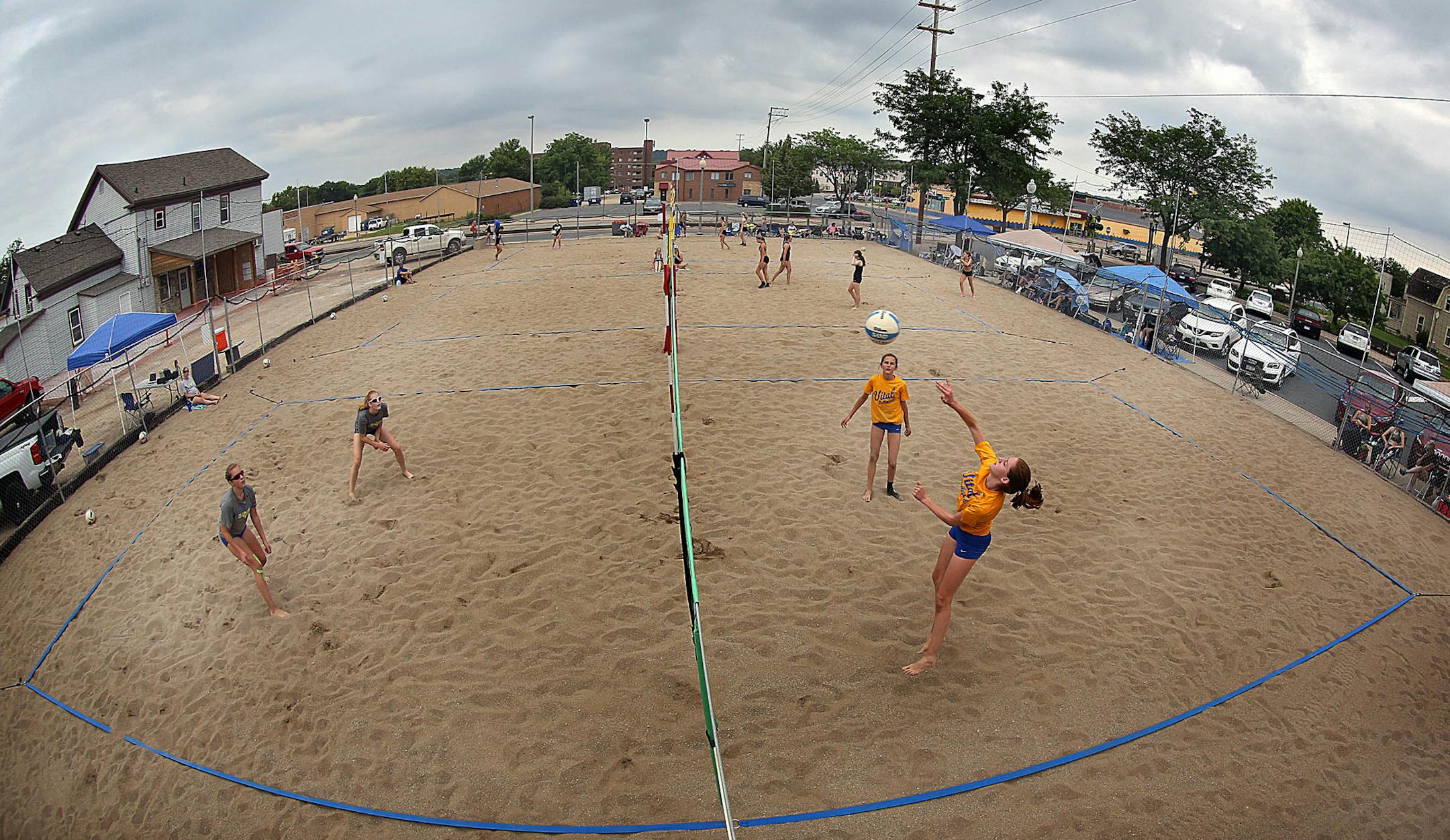 Sand volleyball tournaments, like this one at the Eagles Club in Shakopee, have grown in popularity in recent years for indoor volleyball players to hone their skills.