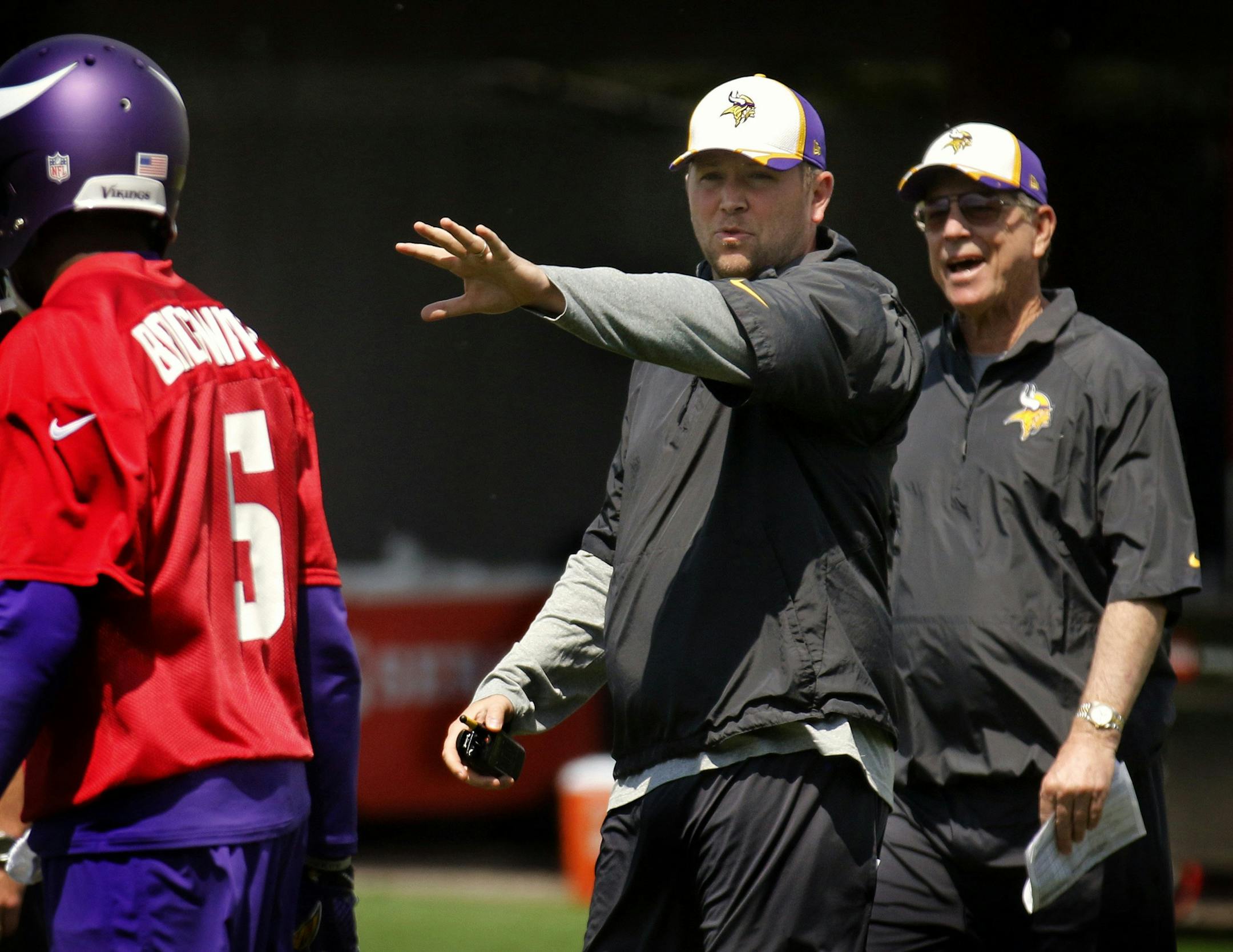 The Vikings fired quarterbacks coach Scott Turner, center, on Monday.