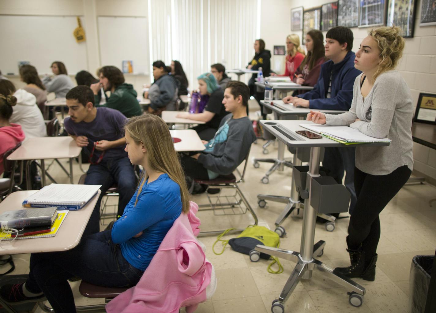 Students across the state are ditching seats for taller standing desks, which advocates are saying will boost test scores and burn calories. Here, Casey Jasper (right) a few other students at Andover High School are using stand up desks in U.S. Government and Politics class. ] Brian.Peterson@startribune.com Andover, MN - 11/24/2015