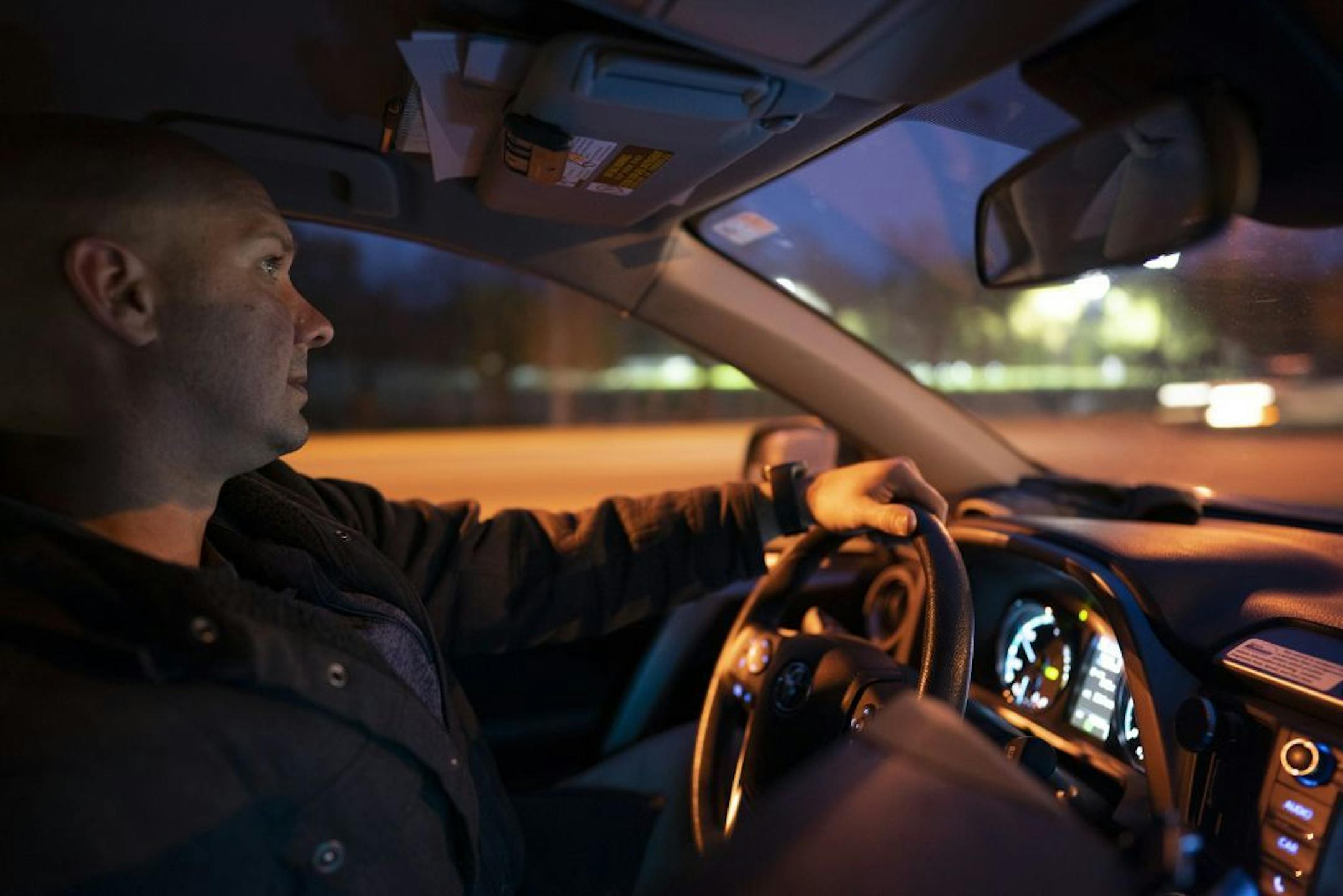 ISR Agent Ricardo Defiel drove on W. Broadway Ave. on his way to a random visit with an inmate on supervised release in Minneapolis Monday night.