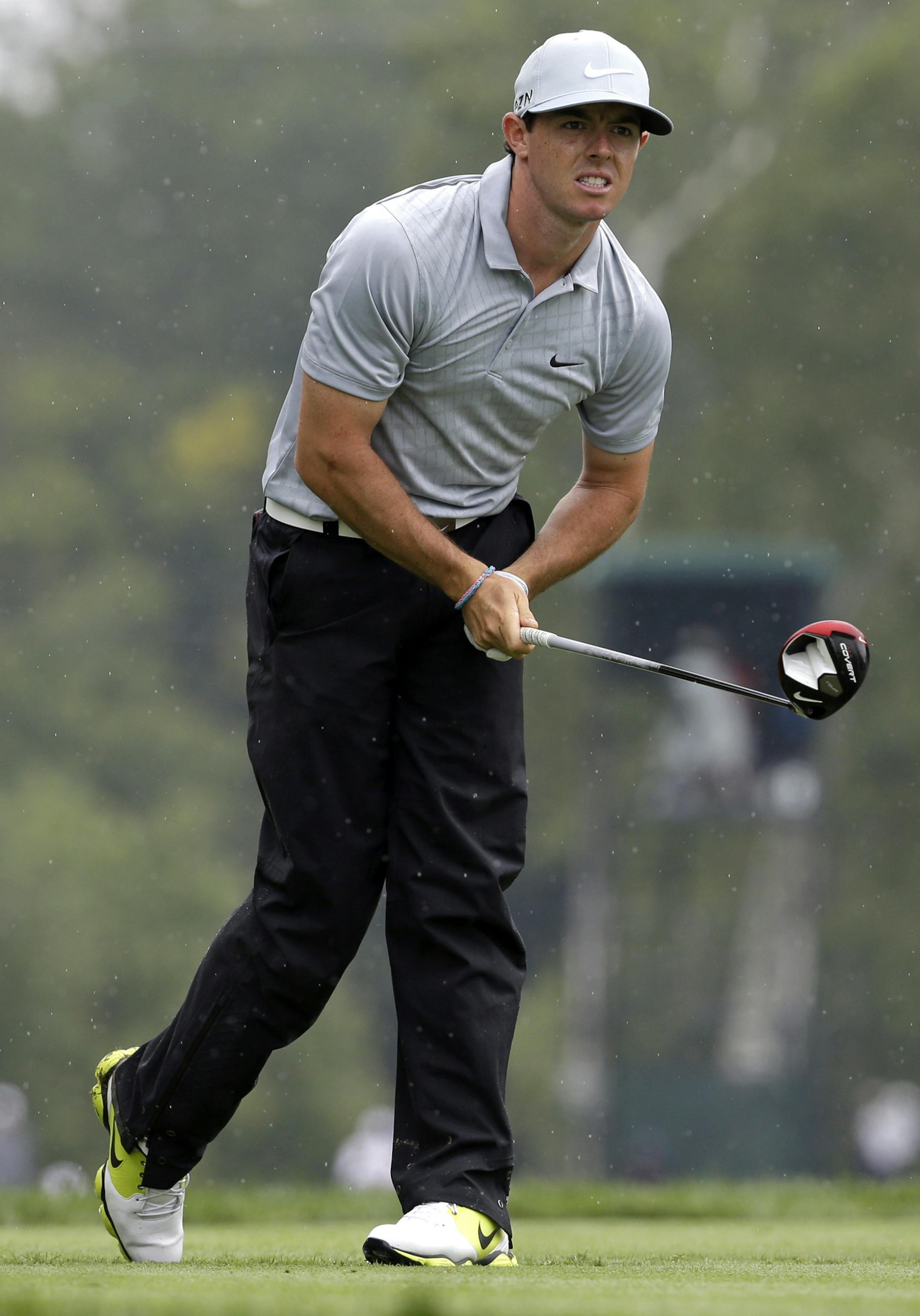 Rory McIlroy, of Northern Ireland, watches his tee shot on the fifth hole during the second round of the PGA Championship golf tournament at Valhalla Golf Club on Friday, Aug. 8, 2014, in Louisville, Ky. (AP Photo/John Locher)