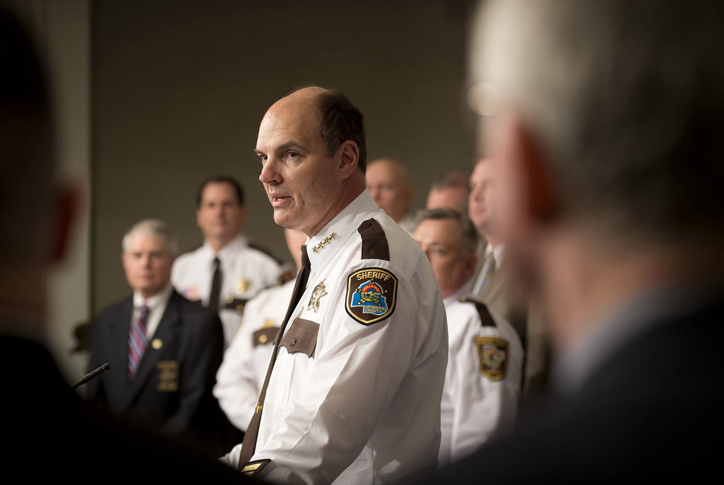 Hennepin County Sheriff Rich Stanek, center, Sheriffs from surrounding counties as well as legislators and prosecutors and others came to the Capitol to discuss strengthening gun background check laws and providing greater access to mental health records for law enforcement, and addressing gaps in providing services to Minnesotans with mental illness. Wednesday, January 23, 2013. ] GLEN STUBBE * gstubbe@startribune.com ORG XMIT: MIN1301231505520052