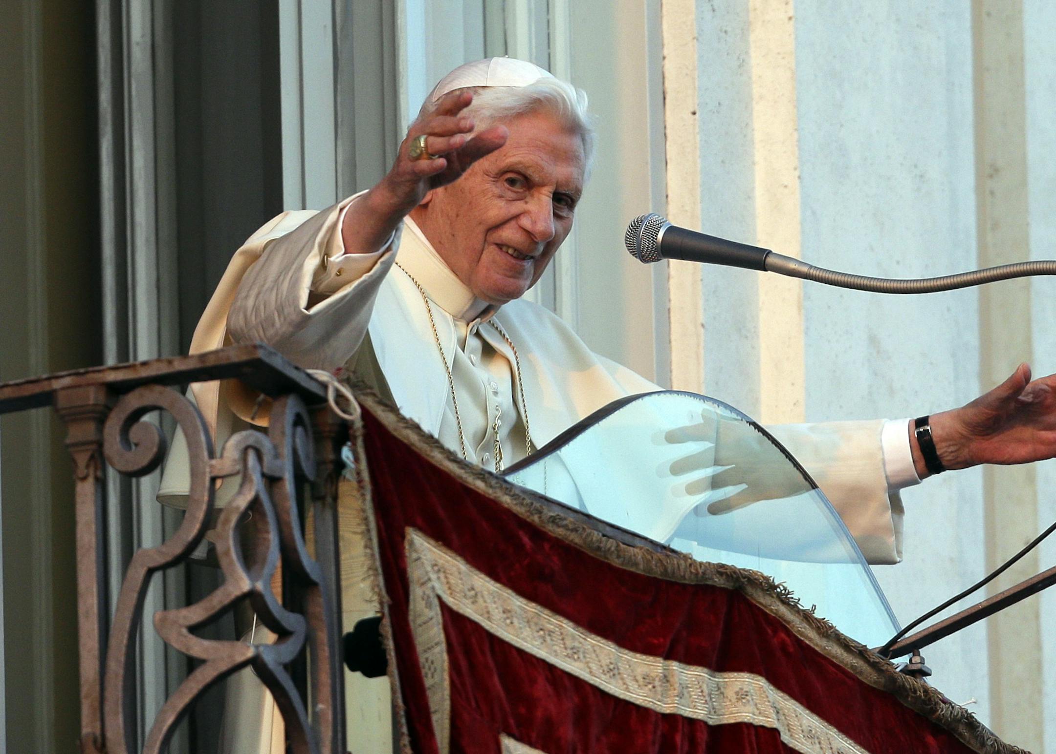 Pope Benedict XVI greets faithful from his summer residence of Castel Gandolfo, the scenic town where he will spend his first post-Vatican days and made his last public blessing as pope,Thursday, Feb. 28, 2013. (AP Photo/Alessandra Tarantino)
