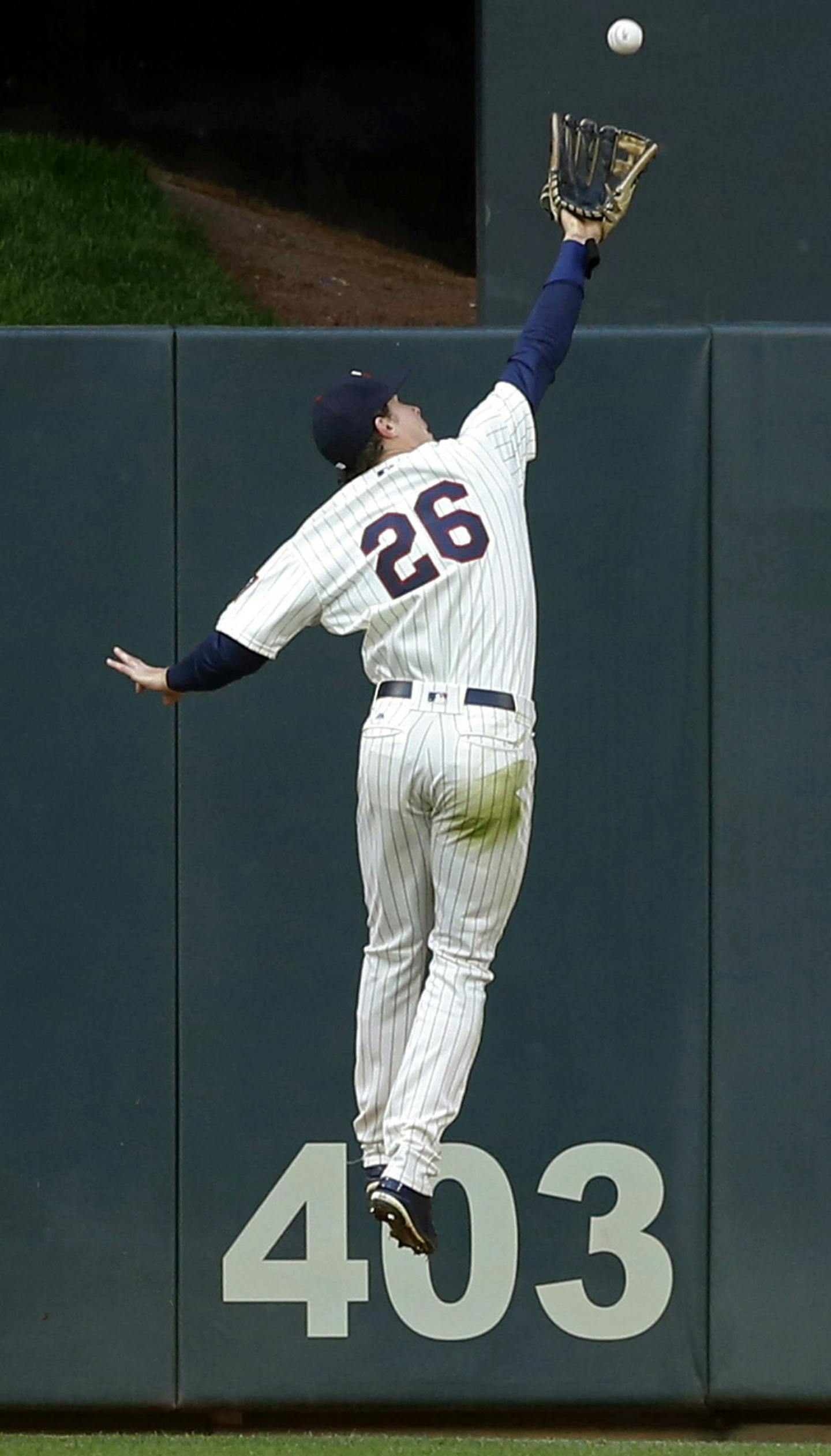 Minnesota Twins center fielder Max Kepler robs Kansas City Royals' Salvador Perez of a hit as he goes up by the wall for the catch in the sixth inning during the second game of a baseball doubleheader Sunday, May 21, 2017 in Minneapolis. (AP Photo/Jim Mone) ORG XMIT: MIN2017052119100647