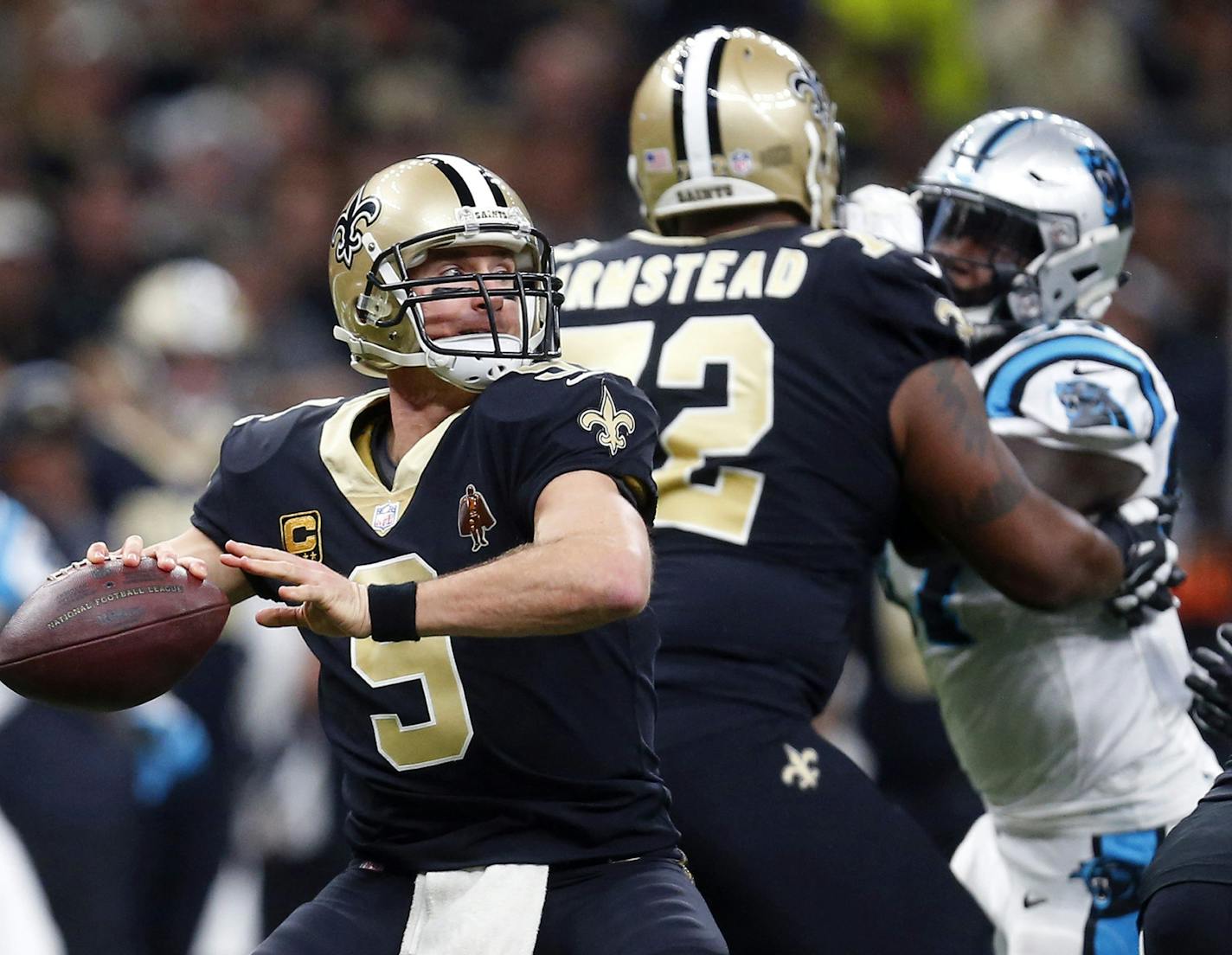 New Orleans Saints quarterback Drew Brees (9) passes in the first half of an NFL football game against the Carolina Panthers in New Orleans, Sunday, Jan. 7, 2018. (AP Photo/Butch Dill)