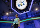 Divya Aggarwal, 13, of Troy, Mich., concentrates as she spells her word during the morning round of the finals of the 2016 National Spelling Bee, in N