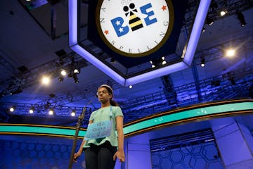 Divya Aggarwal, 13, of Troy, Mich., concentrates as she spells her word during the morning round of the finals of the 2016 National Spelling Bee, in N