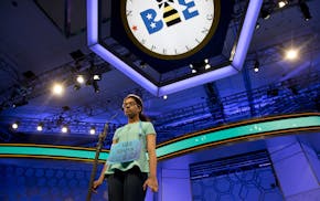 Divya Aggarwal, 13, of Troy, Mich., concentrates as she spells her word during the morning round of the finals of the 2016 National Spelling Bee, in N