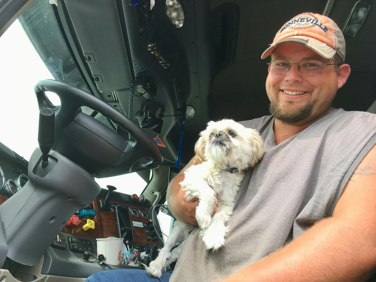 Nebraska trucker Chris Peters with his pup Oscar at Stockman's Truck Stop in South St. Paul.