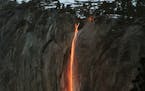 In this Feb. 16, 2010, file photo, a shaft of sunlight creates a glow near Horsetail Fall, in Yosemite National Park, Calif.