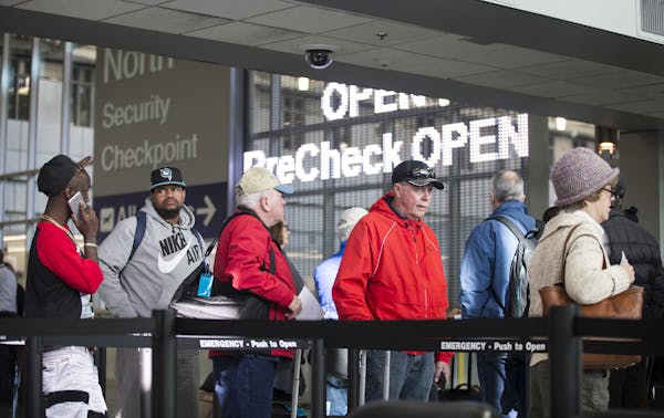 Passengers wait in line Feb. 26 to go through the new north security checkpoint at Terminal 1 of Minneapolis-St. Paul International Airport.