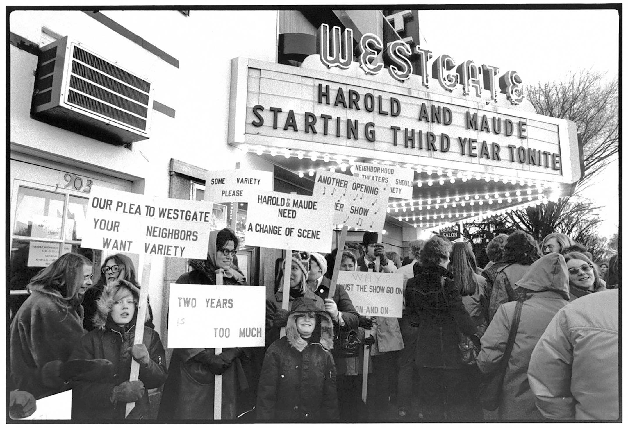 black and white photo of protesters outside the Westgate Theater in Minneapolis