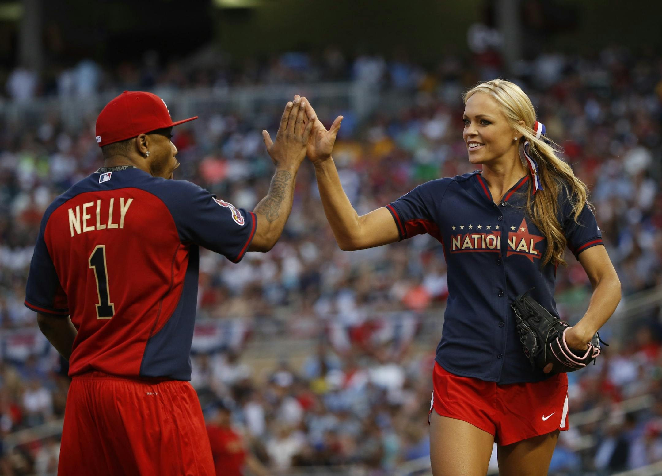 Former U.S. Olympic team softball pitcher Jennie Finch (right).