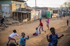 Children play on the street in the afternoon in Kliptown, Soweto.