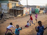 Children play on the street in the afternoon in Kliptown, Soweto.